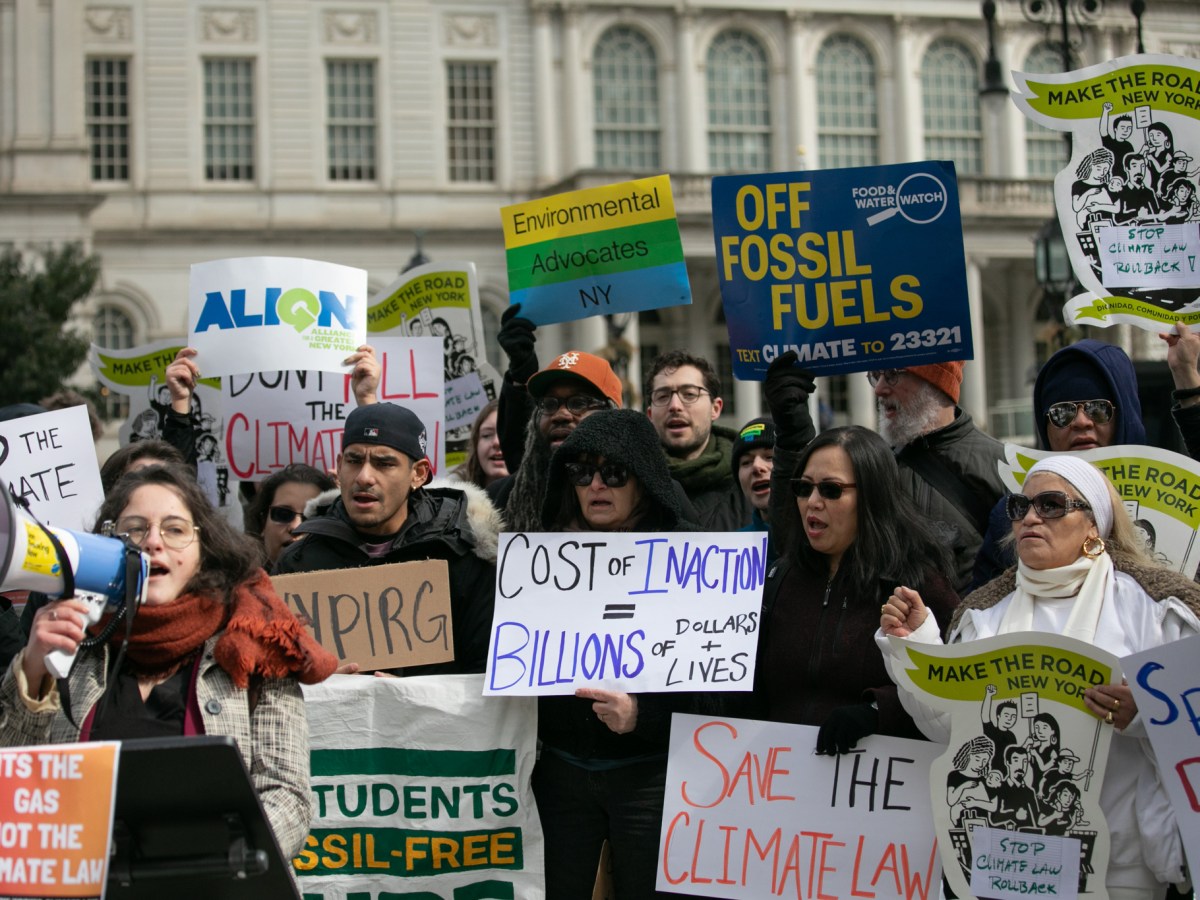 Environmental advocates rally in City Hall Park in support of the state’s climate law after Gov. Kathy Hochul said she would revisit the regulation due to concerns over costs to New Yorkers,