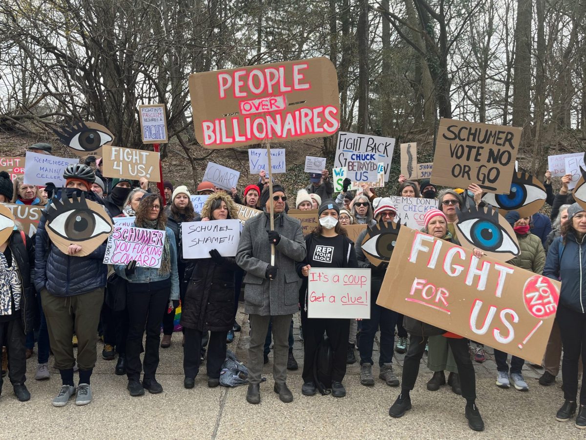 Protesters gathered outside Senate Minority Leader Chuck Schumer’s Park Slope building after he voted to pass the Republican spending bill.