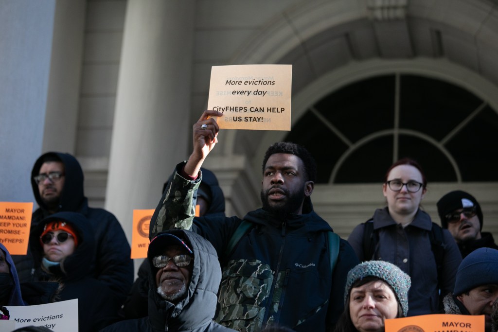 Anti-homelessness advocates rally at City Hall in favor of funding for the CityFHEPS rental voucher program,