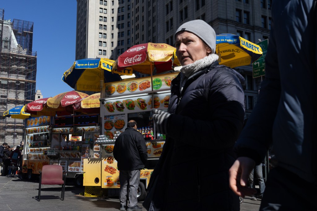 Halal cart vendors serve tourists and workers near City Hall,