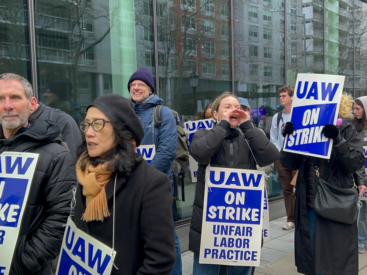 NYU contract faculty members walk a picket line in Lower Manhattan,
