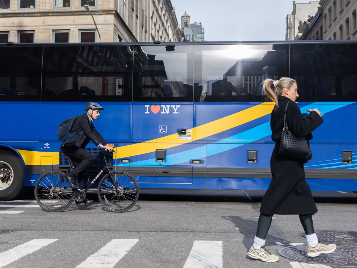 An express bus in Lower Manhattan displayed its wheelchair accessible lift,