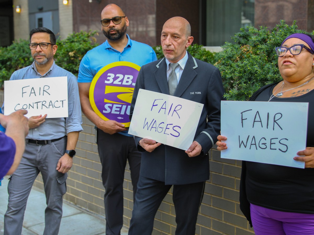 32BJ union leaders and doormen rallied in Yorkville ahead of a strike vote
