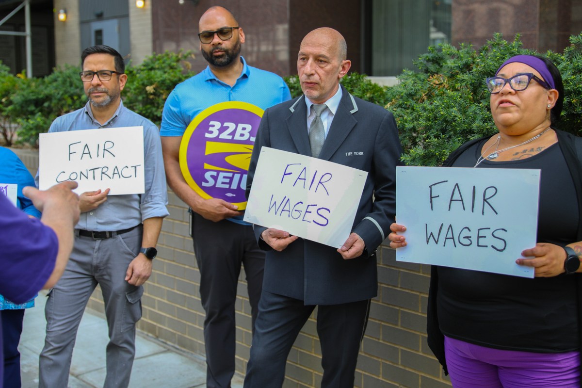 32BJ union leaders and doormen rallied in Yorkville ahead of a strike vote