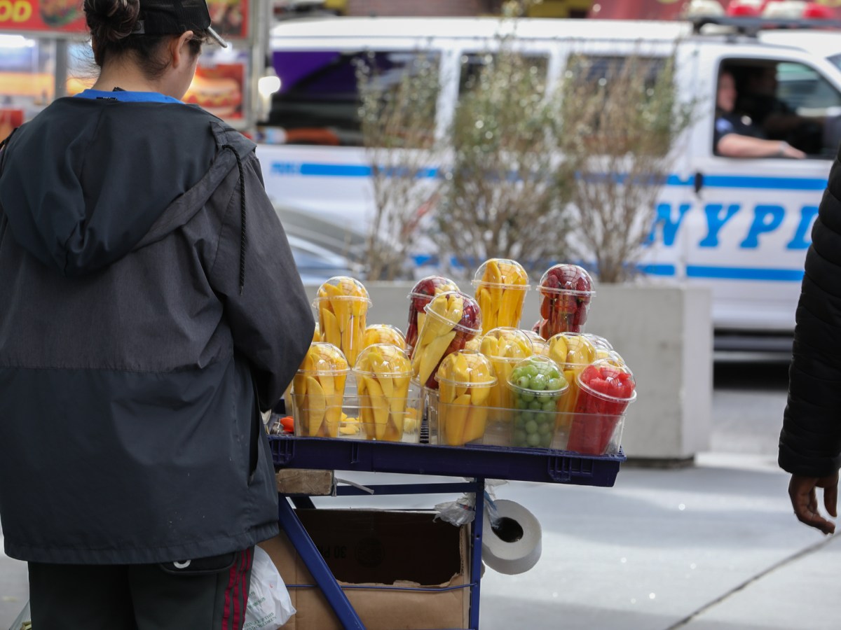 A vendor sells fresh fruit in Midtown.