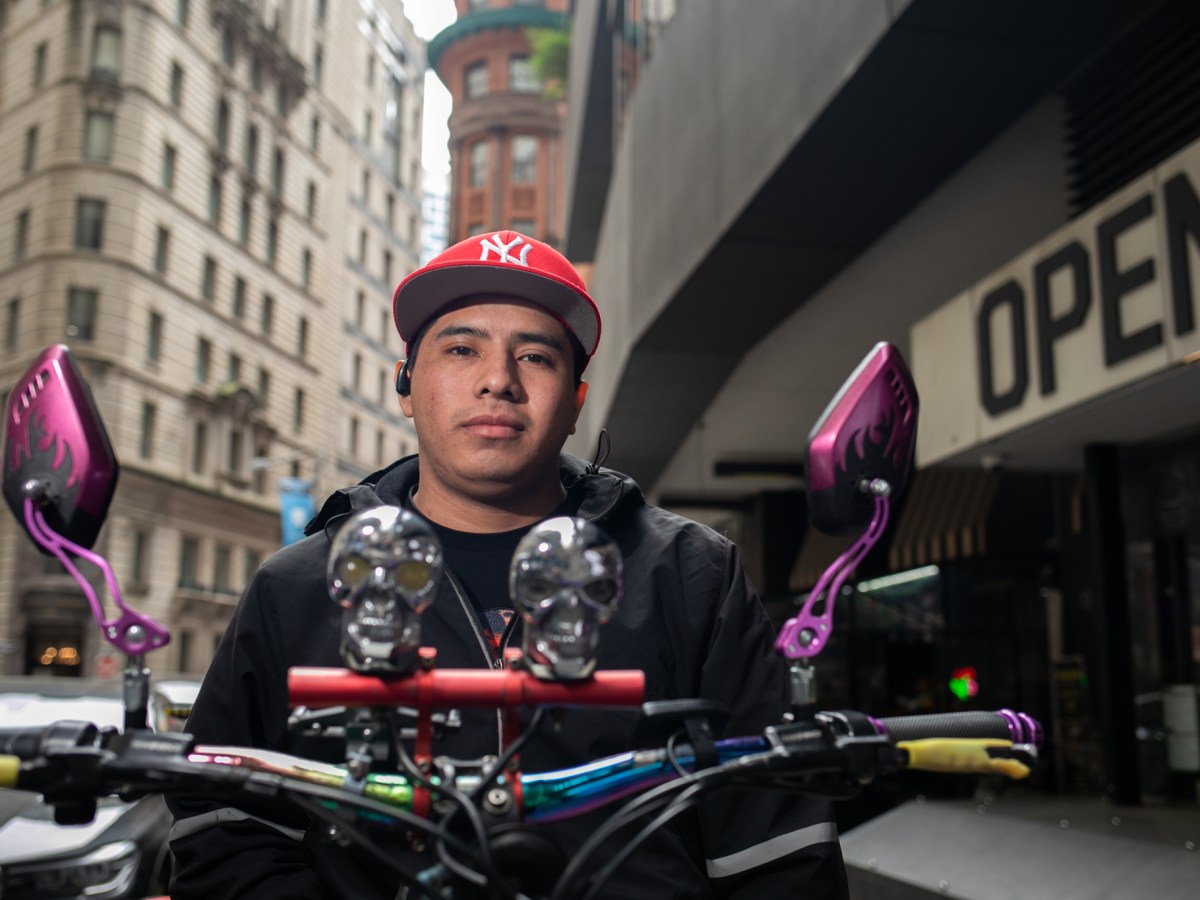 Deliverista Alex shows off his bike during a lunch break in Lower Manhattan,
