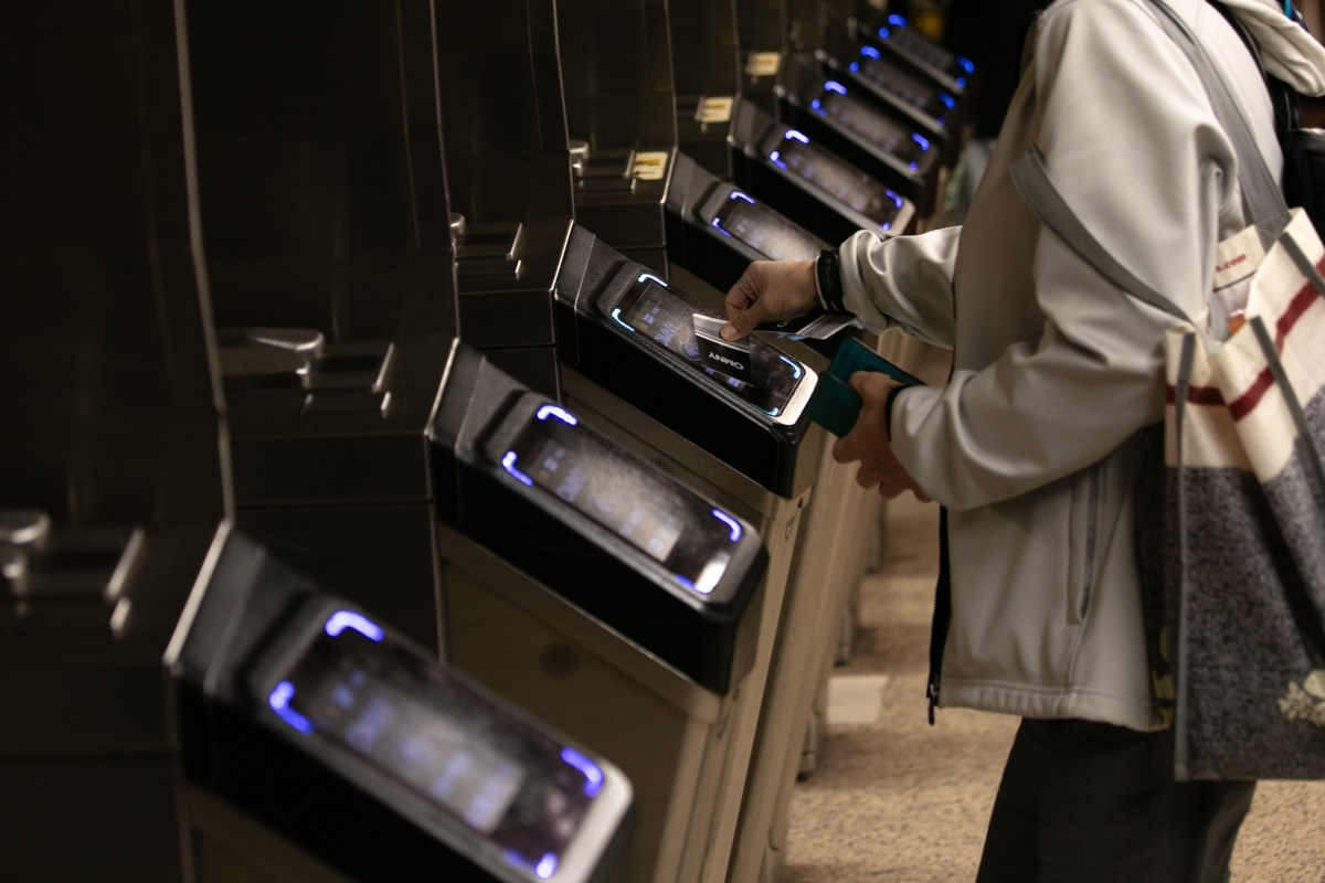 Commuters pay their fare at Bowling Green,