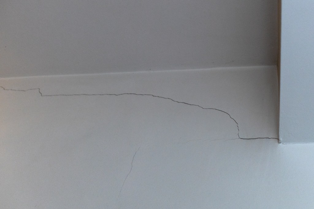 A crack is visible on the wall in Bobby McCullough's Prospect Lefferts Gardens co-op apartment.