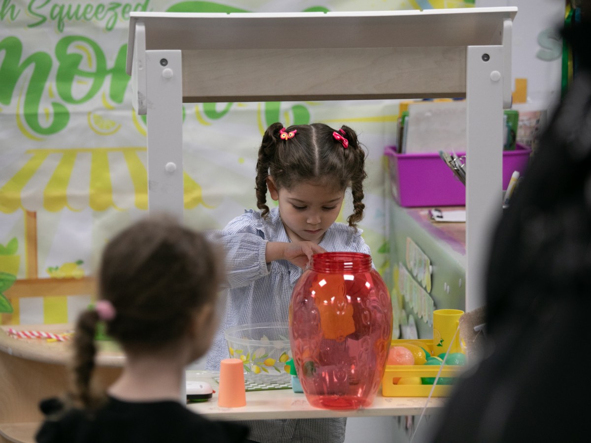 Children do arts and crafts inside an early childhood center in Midtown
