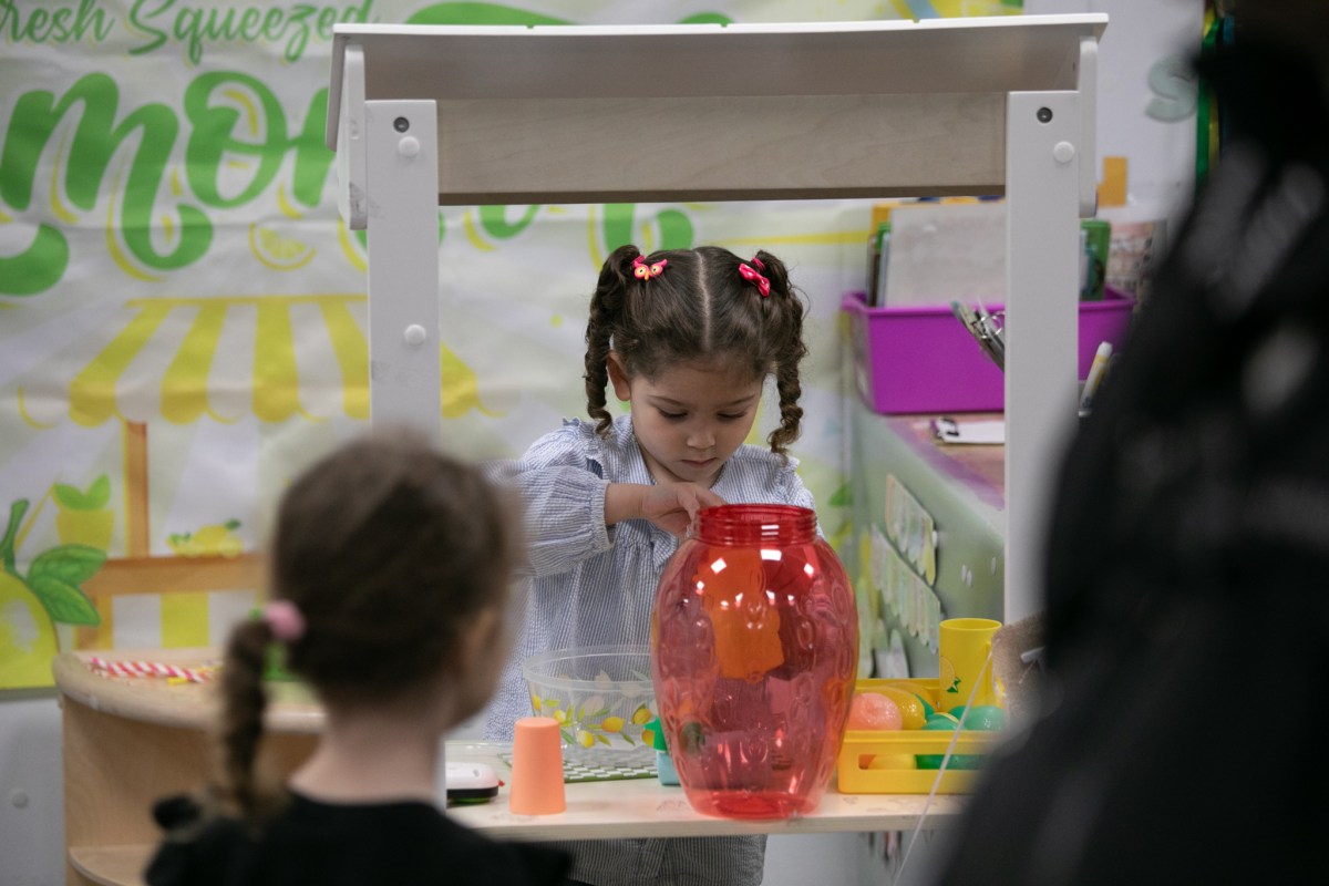Children do arts and crafts inside an early childhood center in Midtown