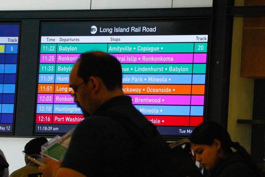 Commuters head to LIRR trains at Penn Station,
