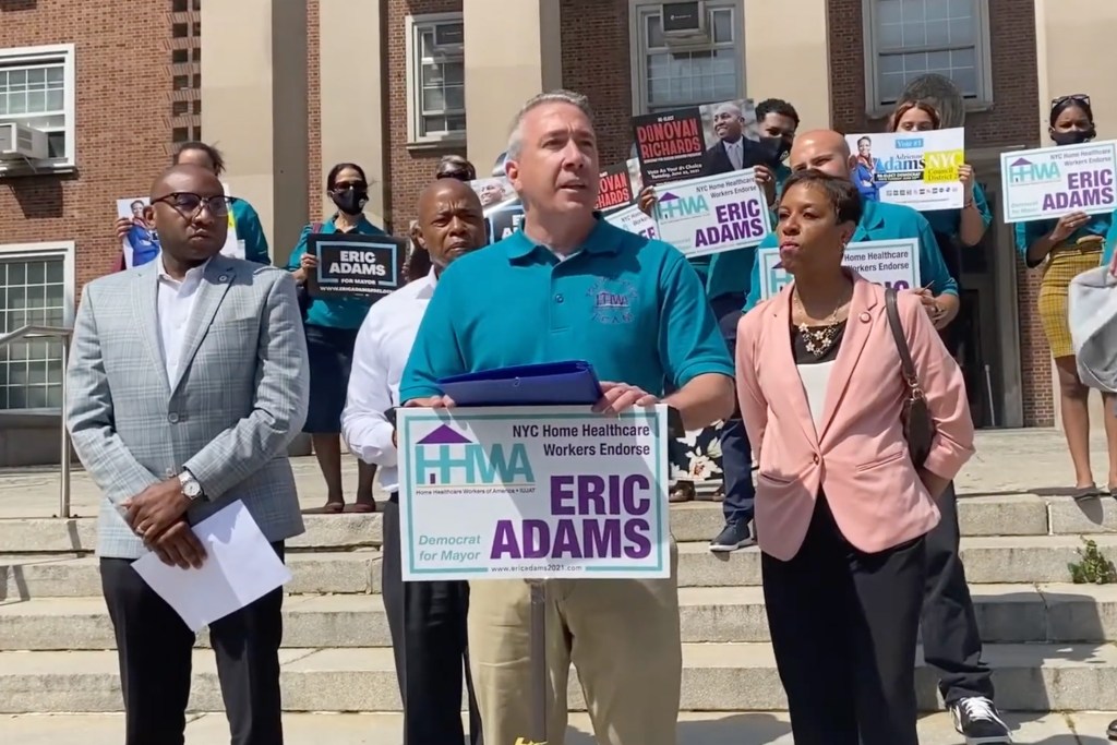 Then-Home Healthcare Workers of America-IUJAT vice president Joe Pecora endorses Eric Adams during a mayoral campaign event at Queens Borough Hall.