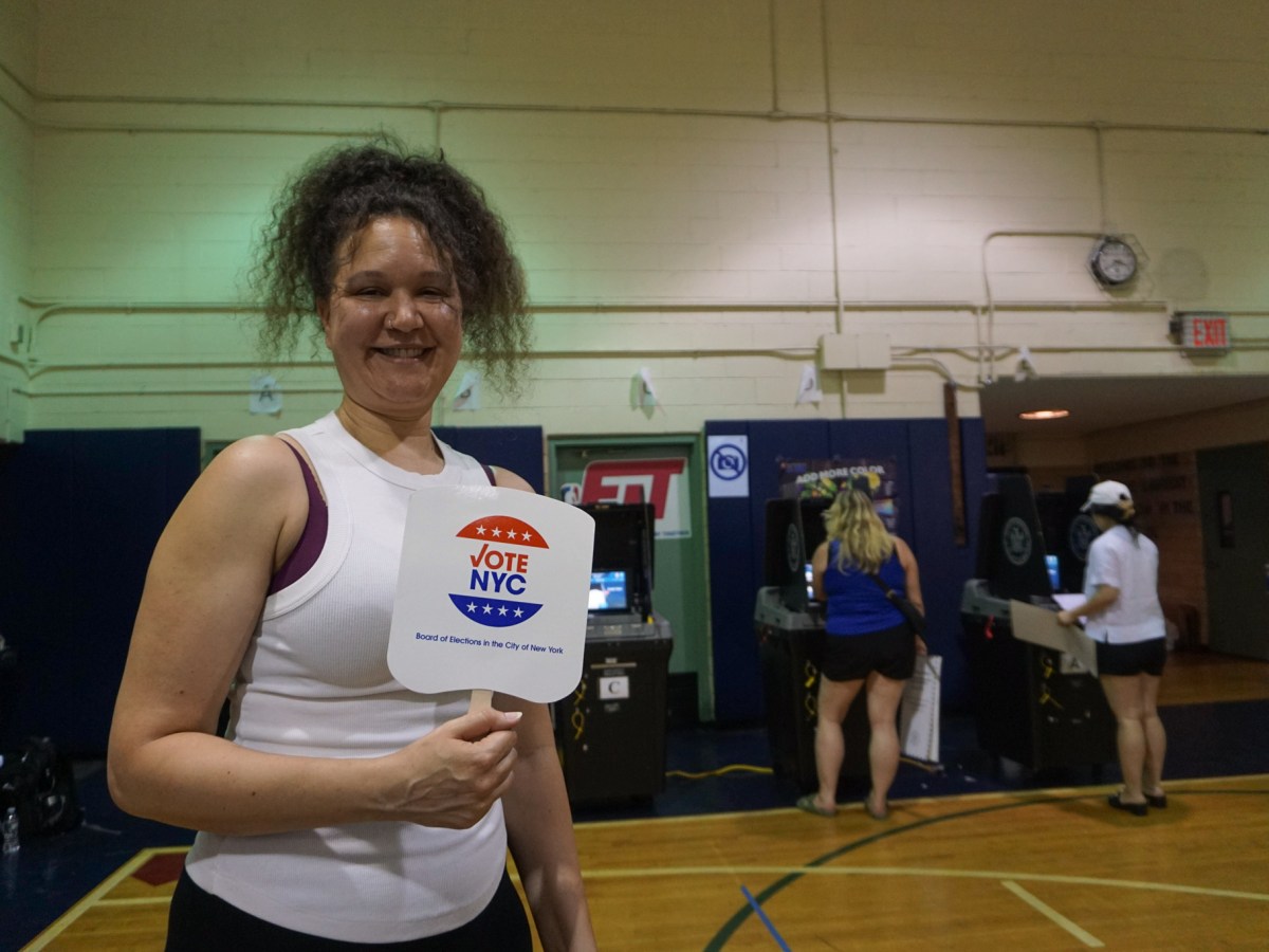 Poll worker Sarah Purvis cooled herself with a Board of Elections fan at a hot polling place inside P.S. 9 in Prospect Heights.