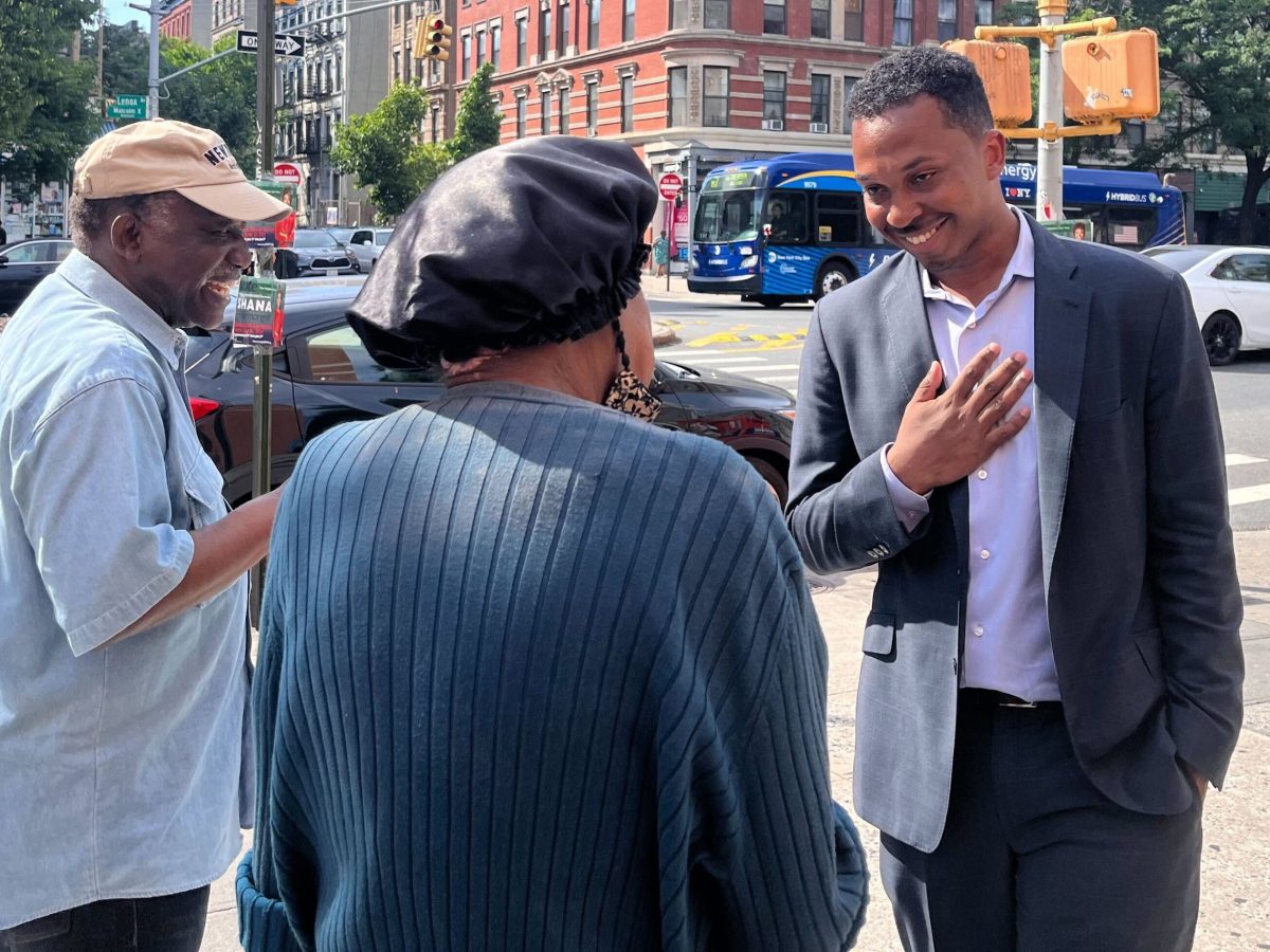 Assembly District 70 candidate Jordan Wright campaigns in Harlem on primary day.