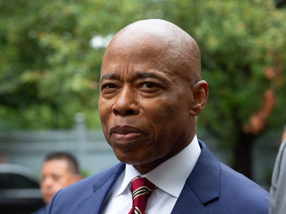 Mayor Eric Adams stands beside his lawyer outside Gracie Mansion after being indicted on federal corruption charges.