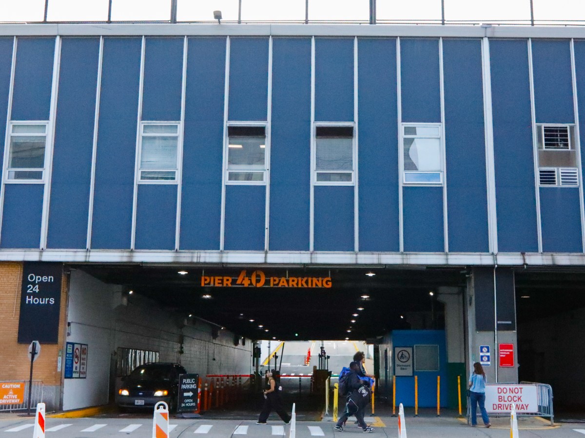People walk past a Chelsea Piers garage