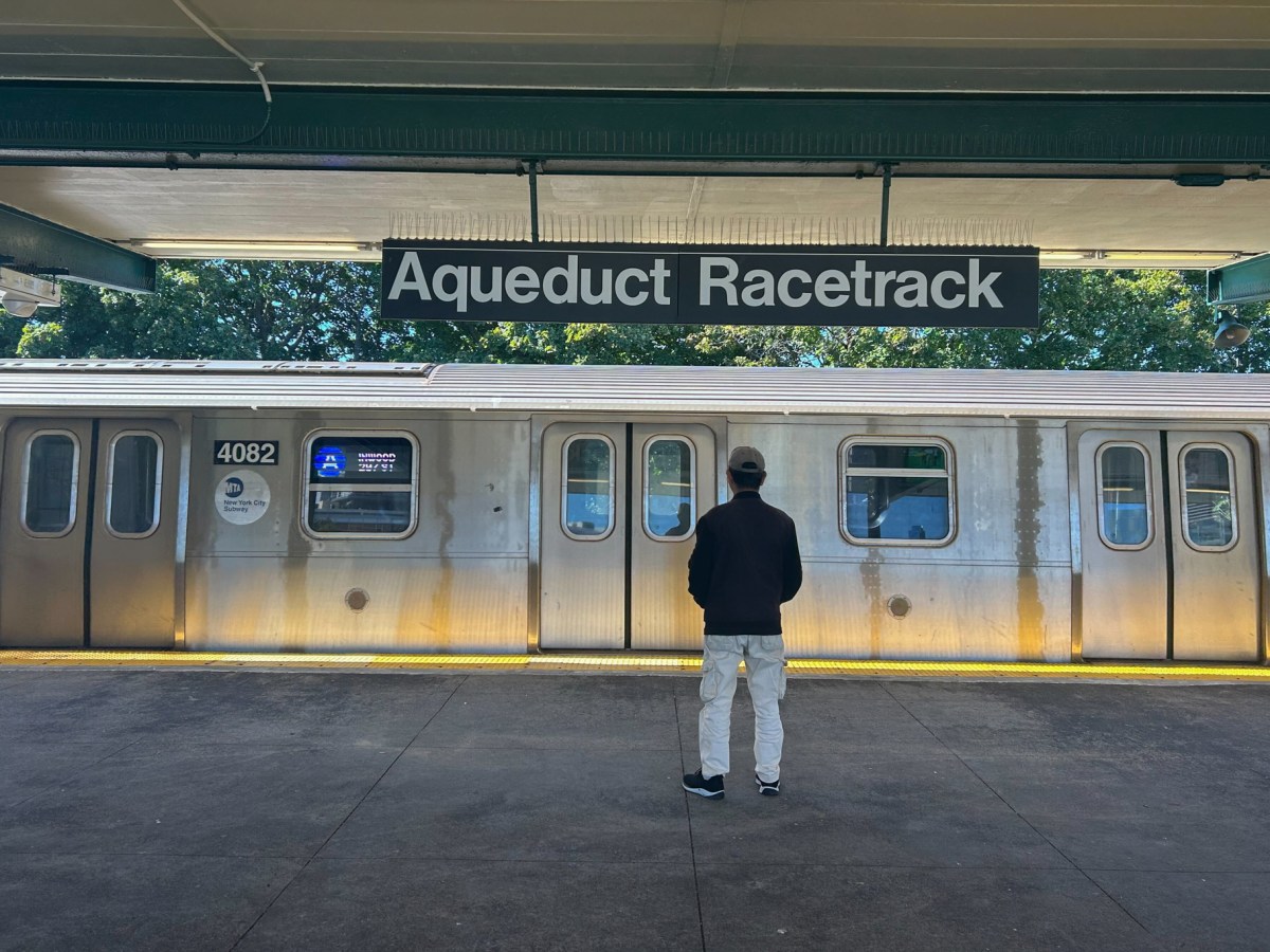 A man waits for a Manhattan-bound A train at the Aqueduct Racetrack stop in Queens, which is the only station in the system with one-way service,