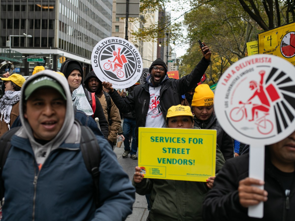 Street vendors and Deliveristas march around City Hall in favor of Council bills that would increase the amount of permits in the wake of federal agents arresting sellers along Canal Street,
