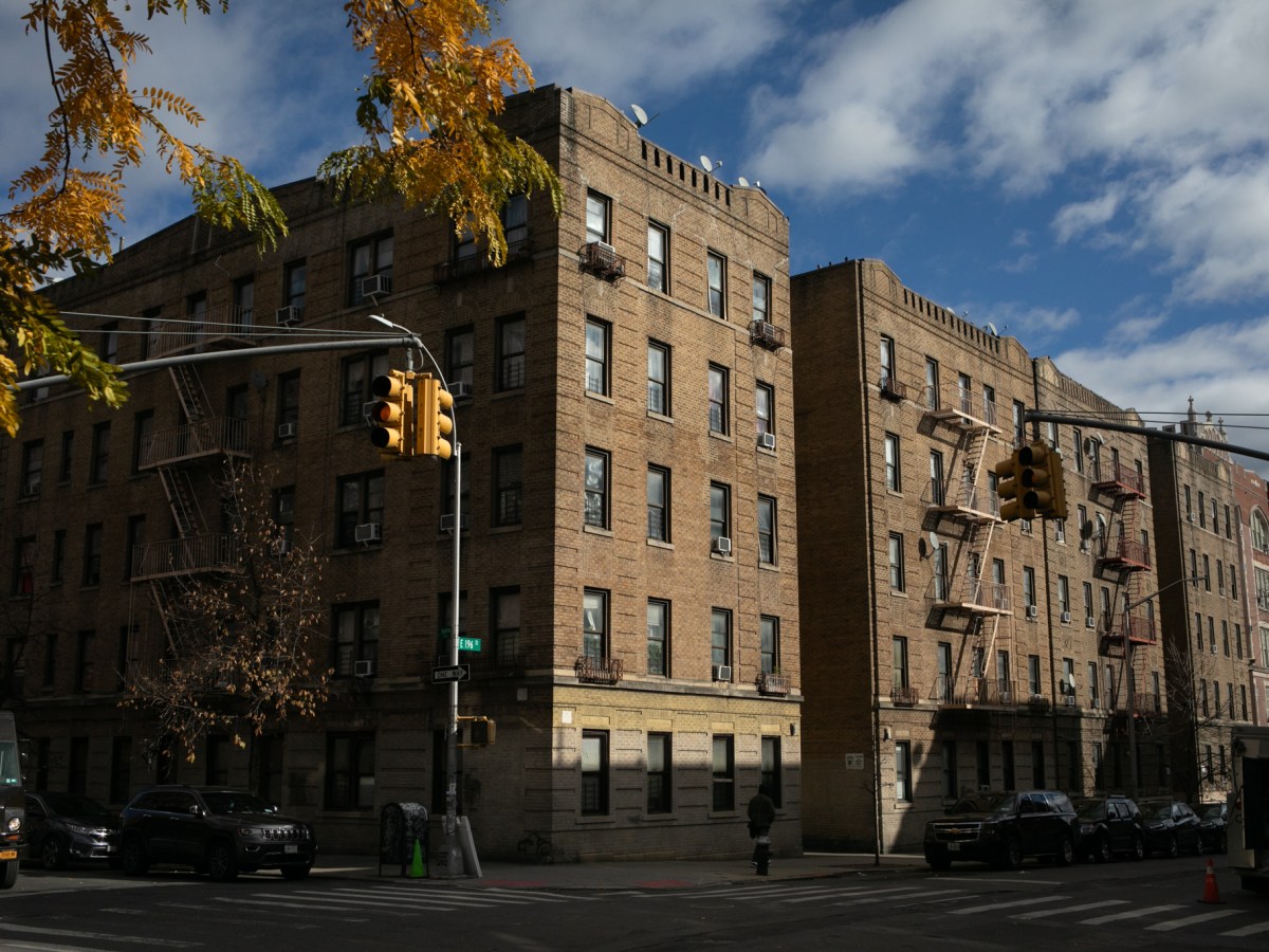 Tenement buildings line a residential block in the North Bronx,