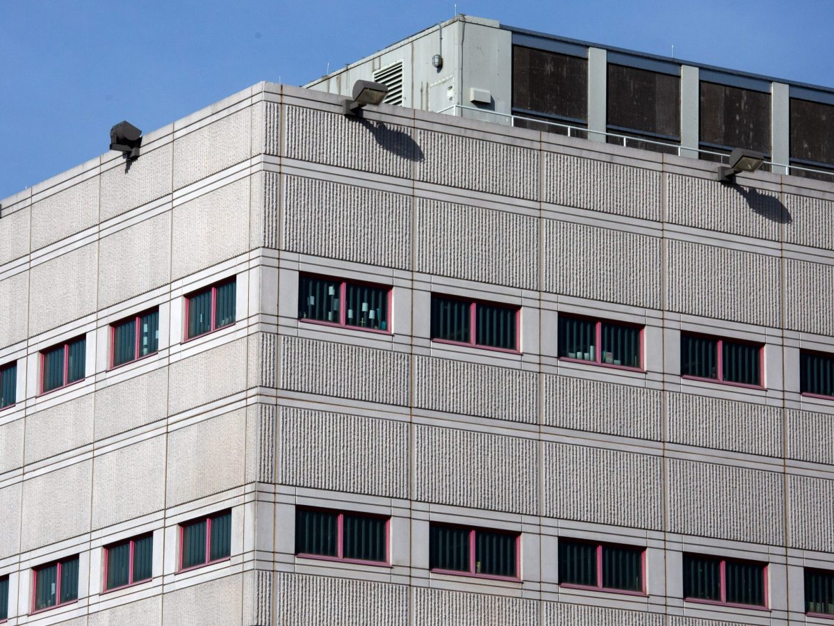 Detainees put makeshift decorations in their Rikers Island jail cell windows.