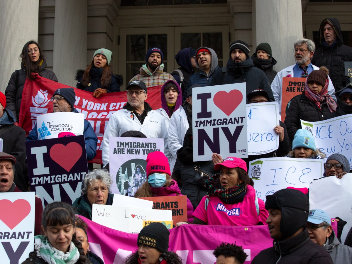 Immigrant-rights advocates rally outside City Hall ahead of a hearing on strengthening New York’s sanctuary city protections,