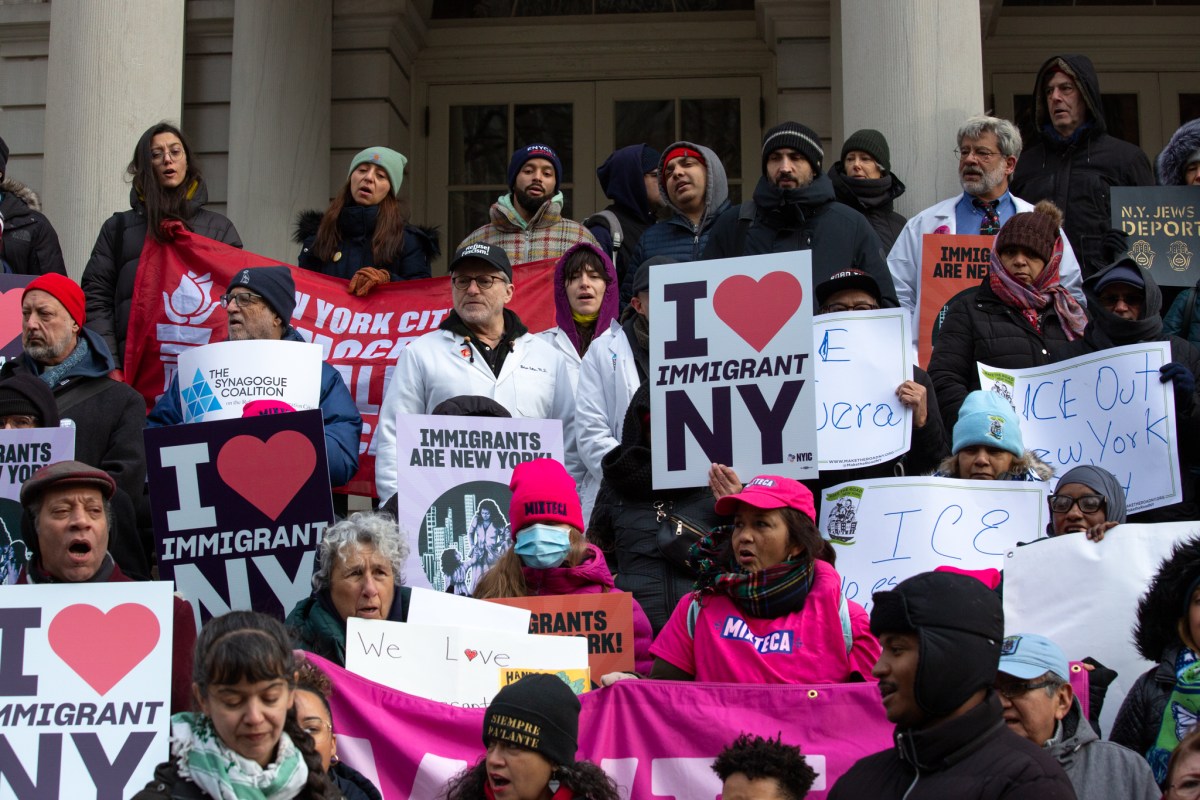 Immigrant-rights advocates rally outside City Hall ahead of a hearing on strengthening New York’s sanctuary city protections,