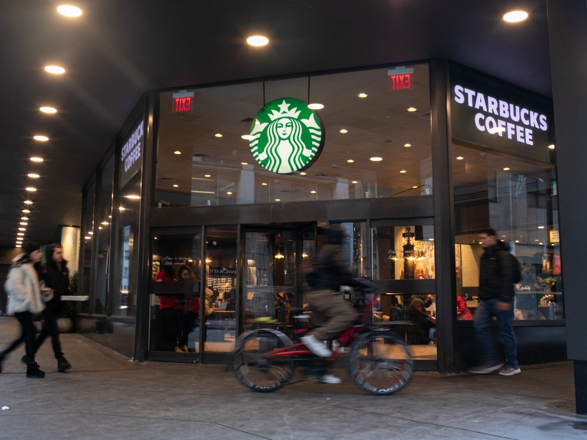 A Financial District Starbucks serves coffee drinks near the Stock Exchange