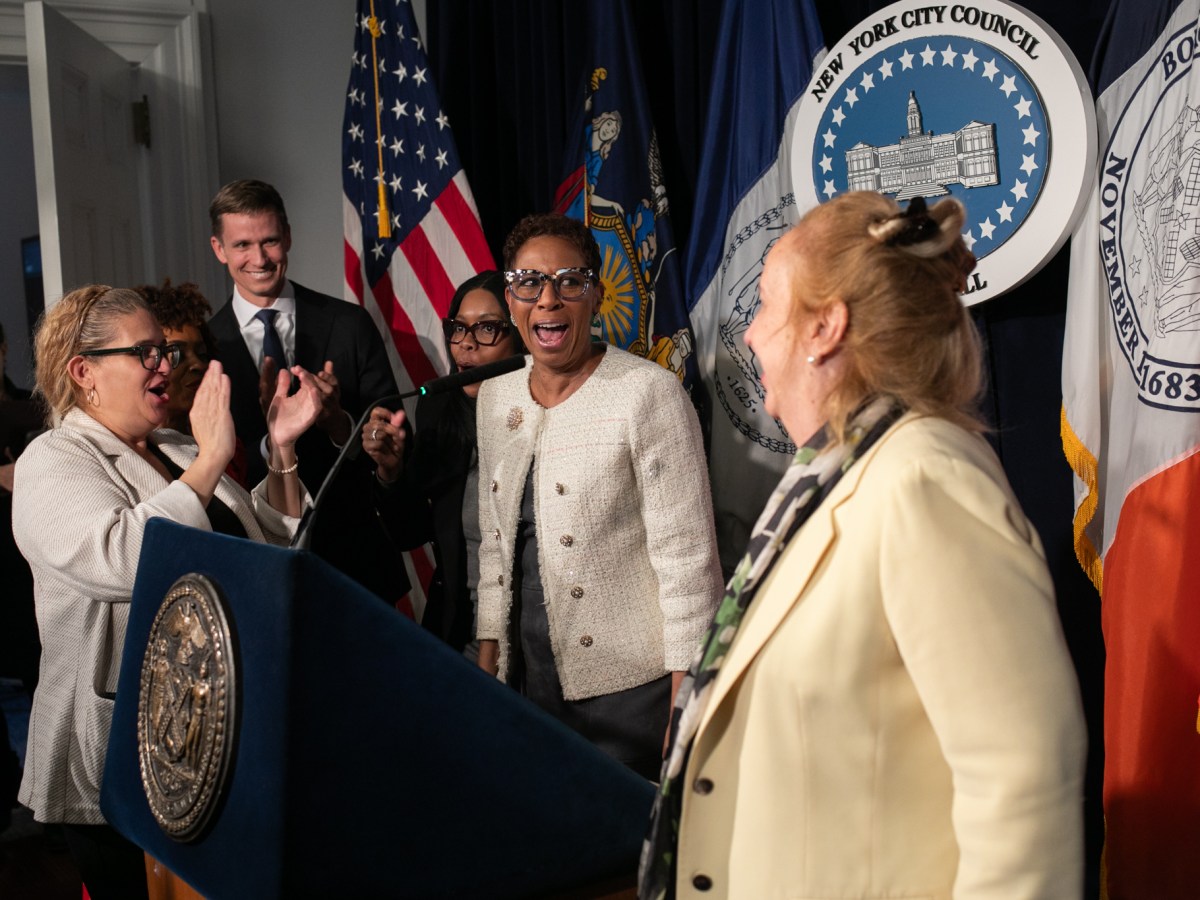 Councilmembers applaud Speaker Adrienne Adams (D-Queens) during her final pre-stated meeting press conference,