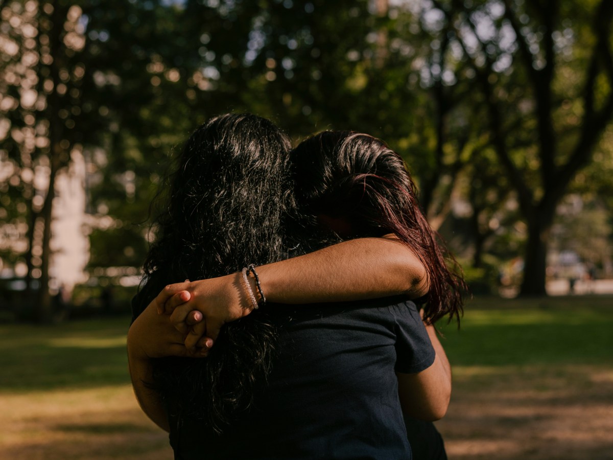Bridget, a first-year student at ELLIS Preparatory Academy, hugs her mother Marta in Manhattan's Madison Square Park.