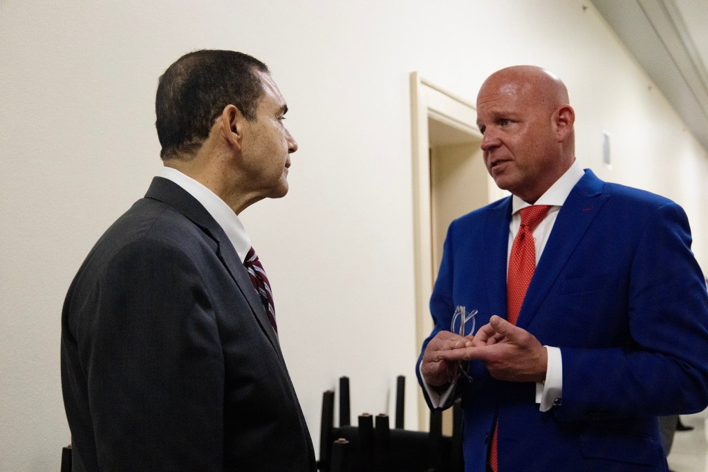 Securus President Kevin Elder speaks with Texas Congressional Rep. Henry Cuellar,