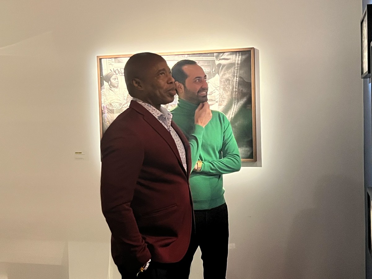 Johnny Petrosyants looks at artwork with then-Mayor Eric Adams in 2023.