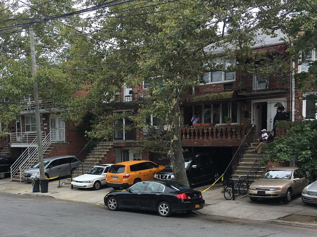 Residents sat on stoops on a South Brooklyn row houses block.